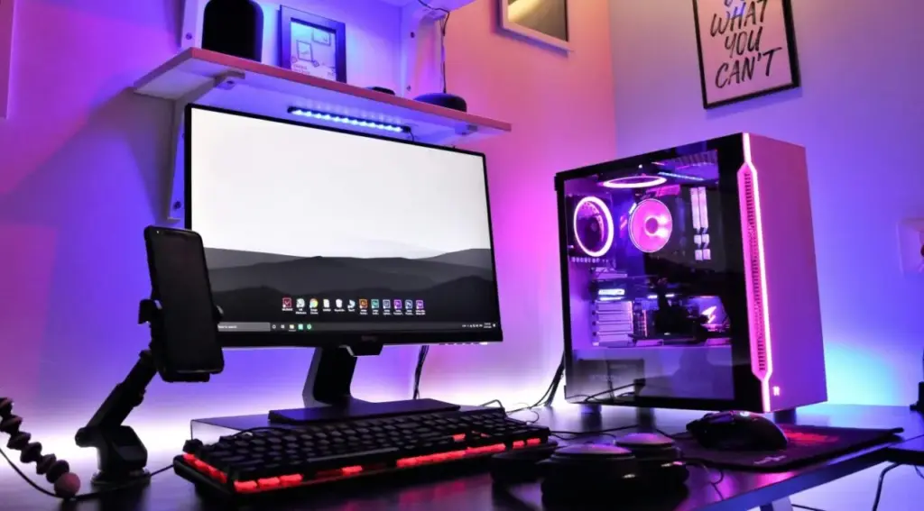 Setup Gaming PC Modern 2026 dengan Game Seru dan Grafis Realistis Setup gaming PC modern tahun 2026 dengan monitor gaming, keyboard RGB, dan tampilan game grafis tinggi yang imersif